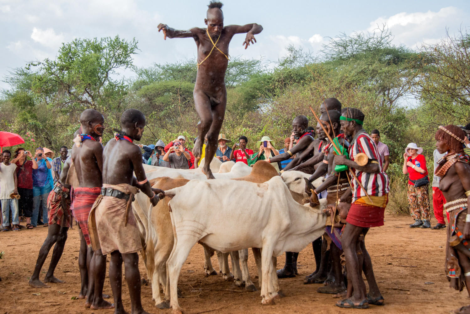 Coming of Age, Cow jumping : Ethiopia,  Vanishing Omo Tribess : ELIZABETH SANJUAN PHOTOGRAPHY